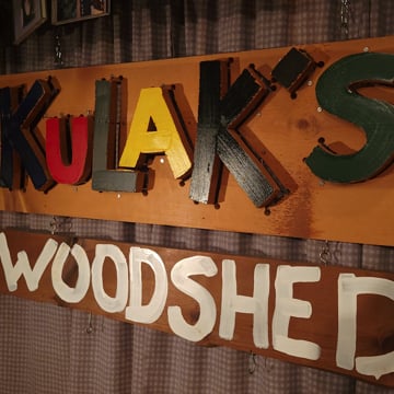The hand-painted Kulak's Woodshed sign, with colorful wooden letters